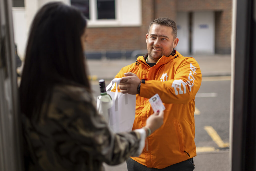 A courier delivering alcohol