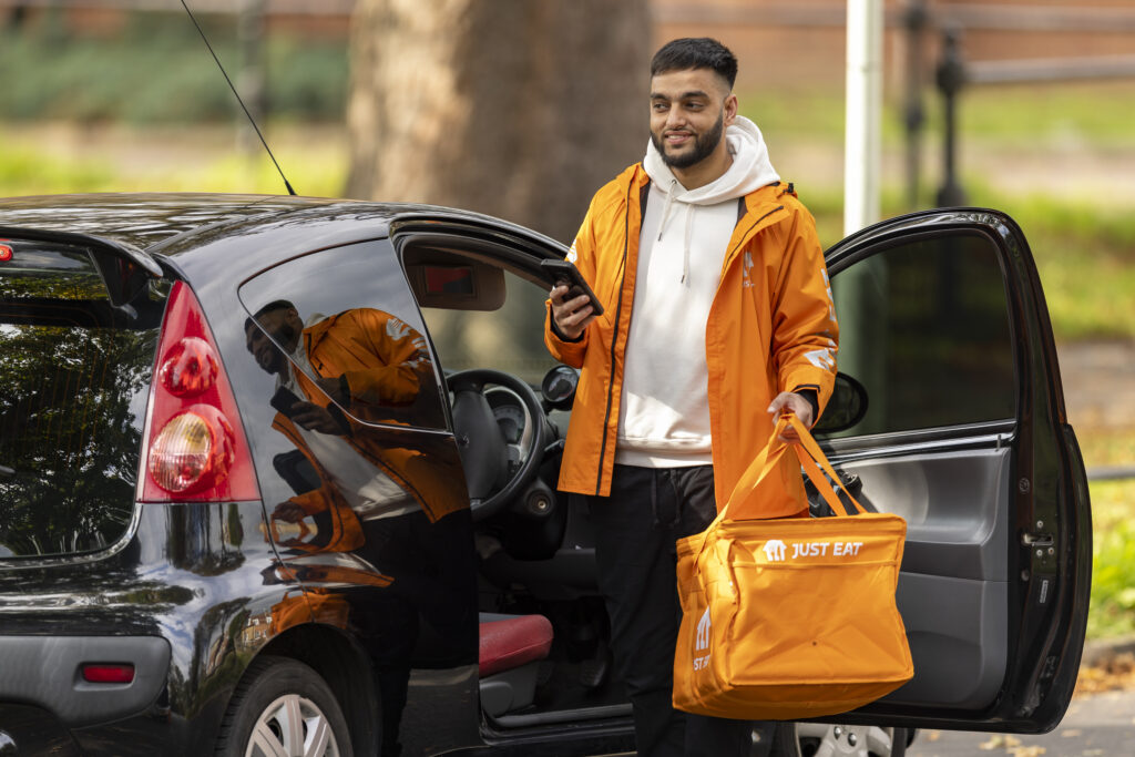 A Just Eat courier delivering an order