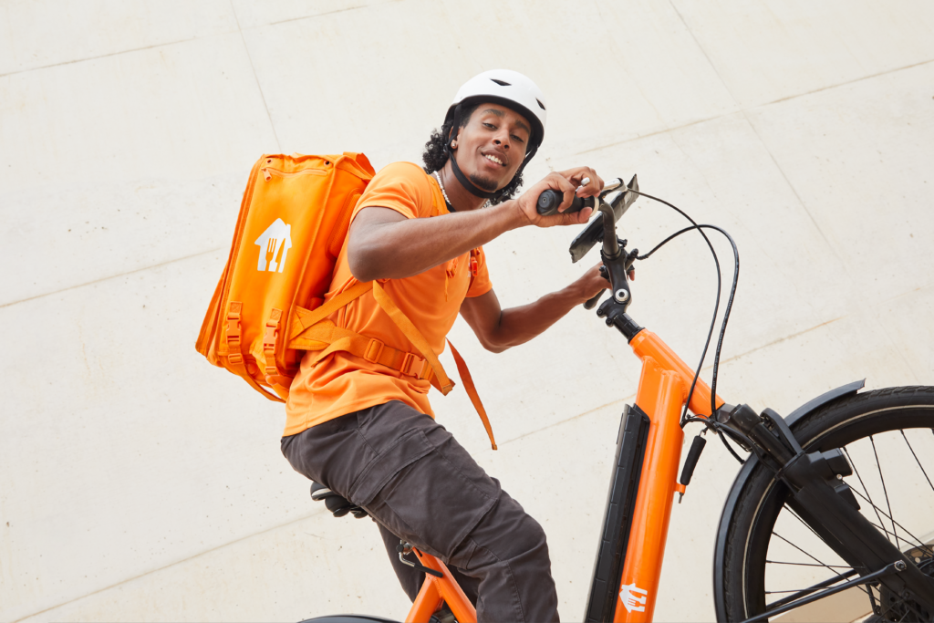 A Just Eat courier on a bike