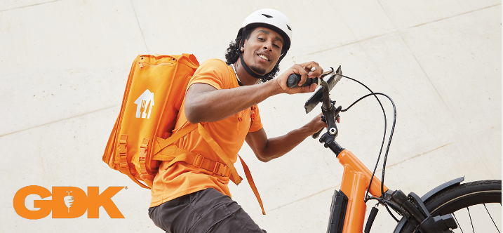 A Just Eat courier on a bike
