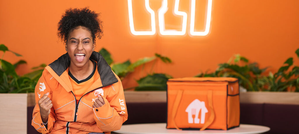 A Just Eat courier celebrating